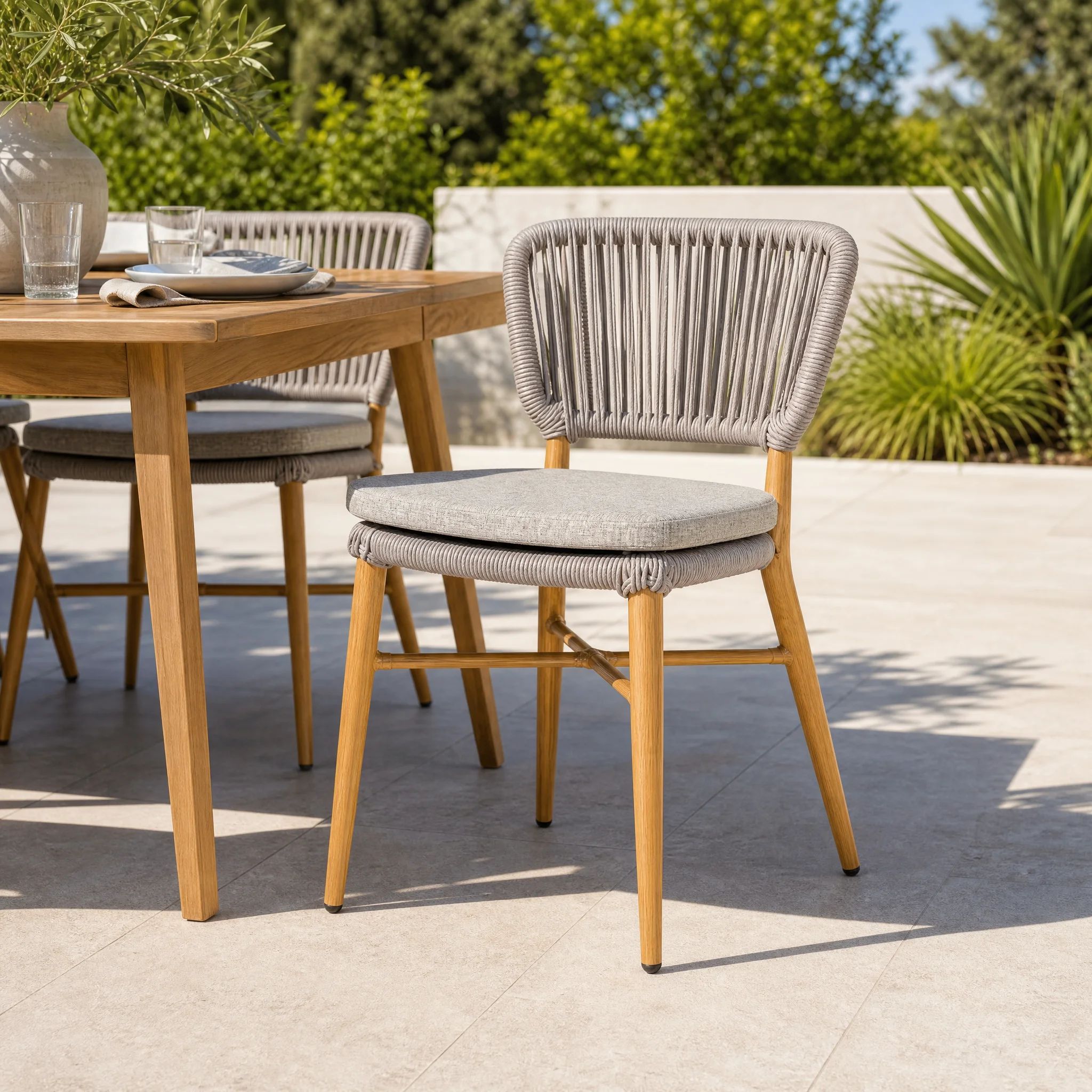 Generated with Kive.ai - Woven dining chair A sunny modern outdoor dining set.png